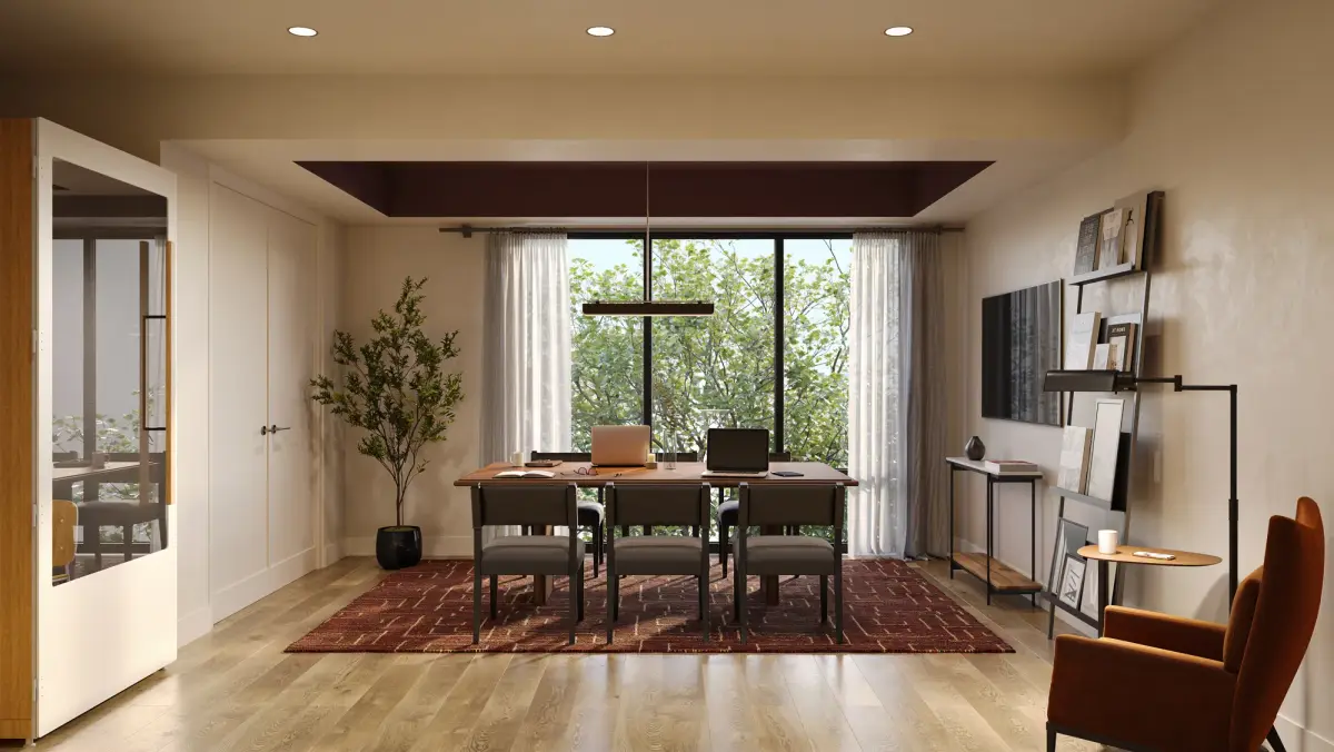 Flex room with a wood work table, two laptops, plum tray ceiling, ladder shelving, and a rust armchair by tall windows