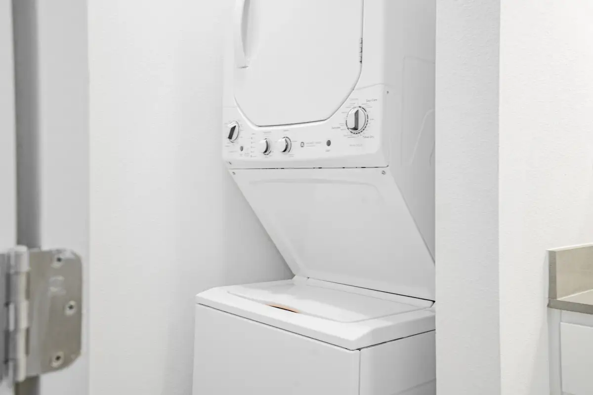 In-unit stacked washer and dryer in a closet