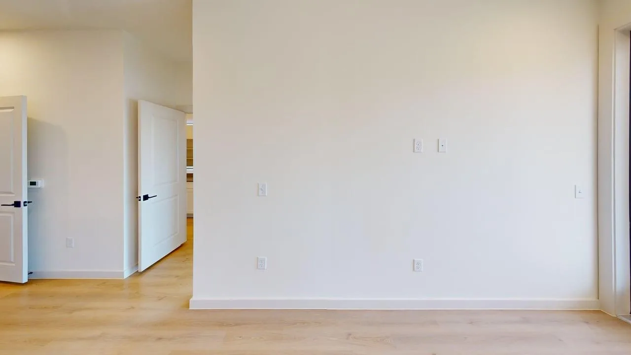 Living room of the finished A1 one bedroom at The Parker