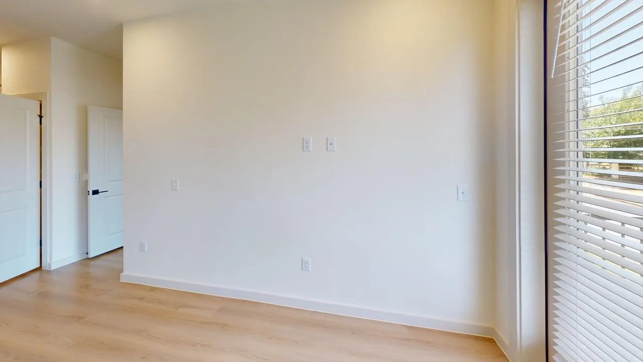 Living room of the finished B1 two bedroom at The Parker
