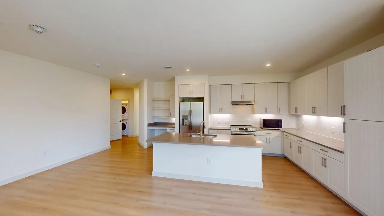 Living room of the finished C1 three bedroom at The Parker
