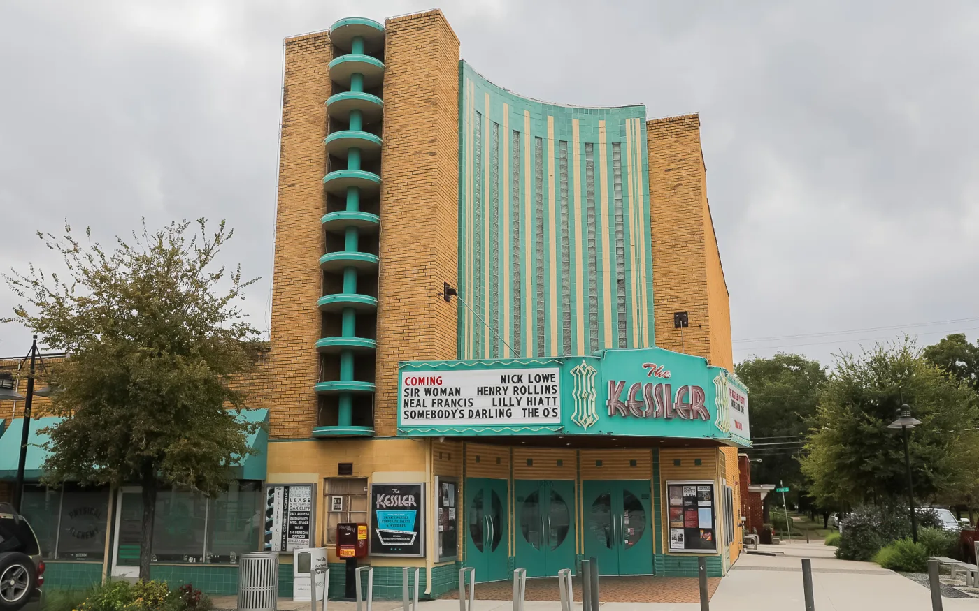The teal art deco tower and marquee of the Kessler Theater on West Davis Street
